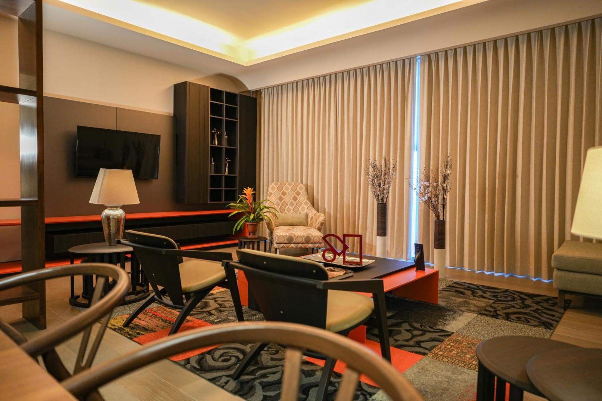 Metria Hotel เลออน ภายนอก รูปภาพ A living room in a condominium